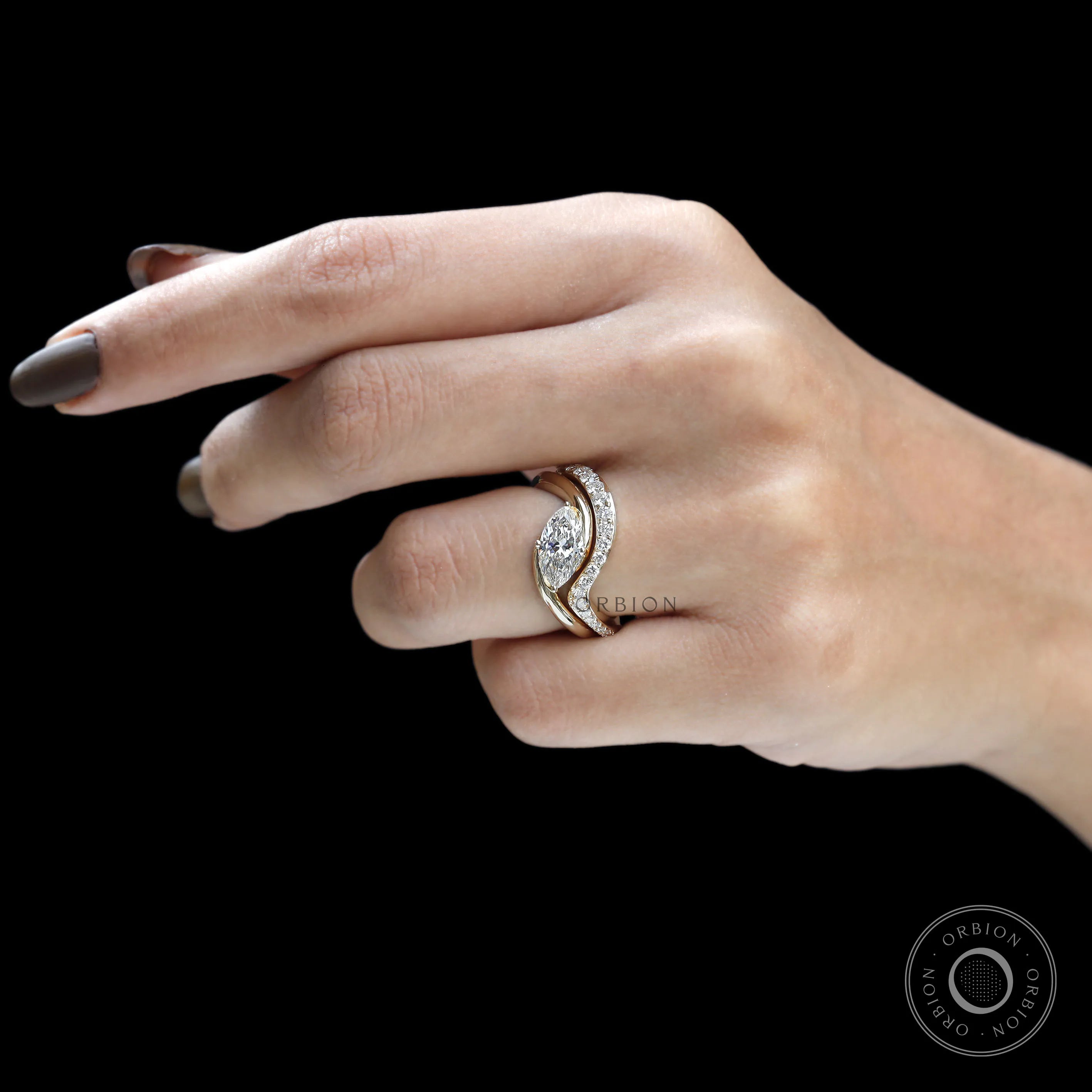 Marquise engagement ring and wedding band set in yellow gold