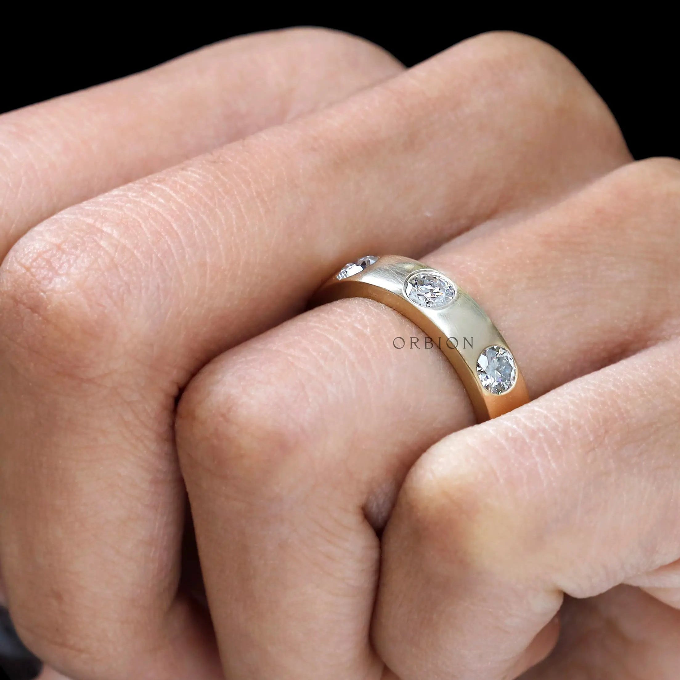 Wide flush set diamond ring macro detail