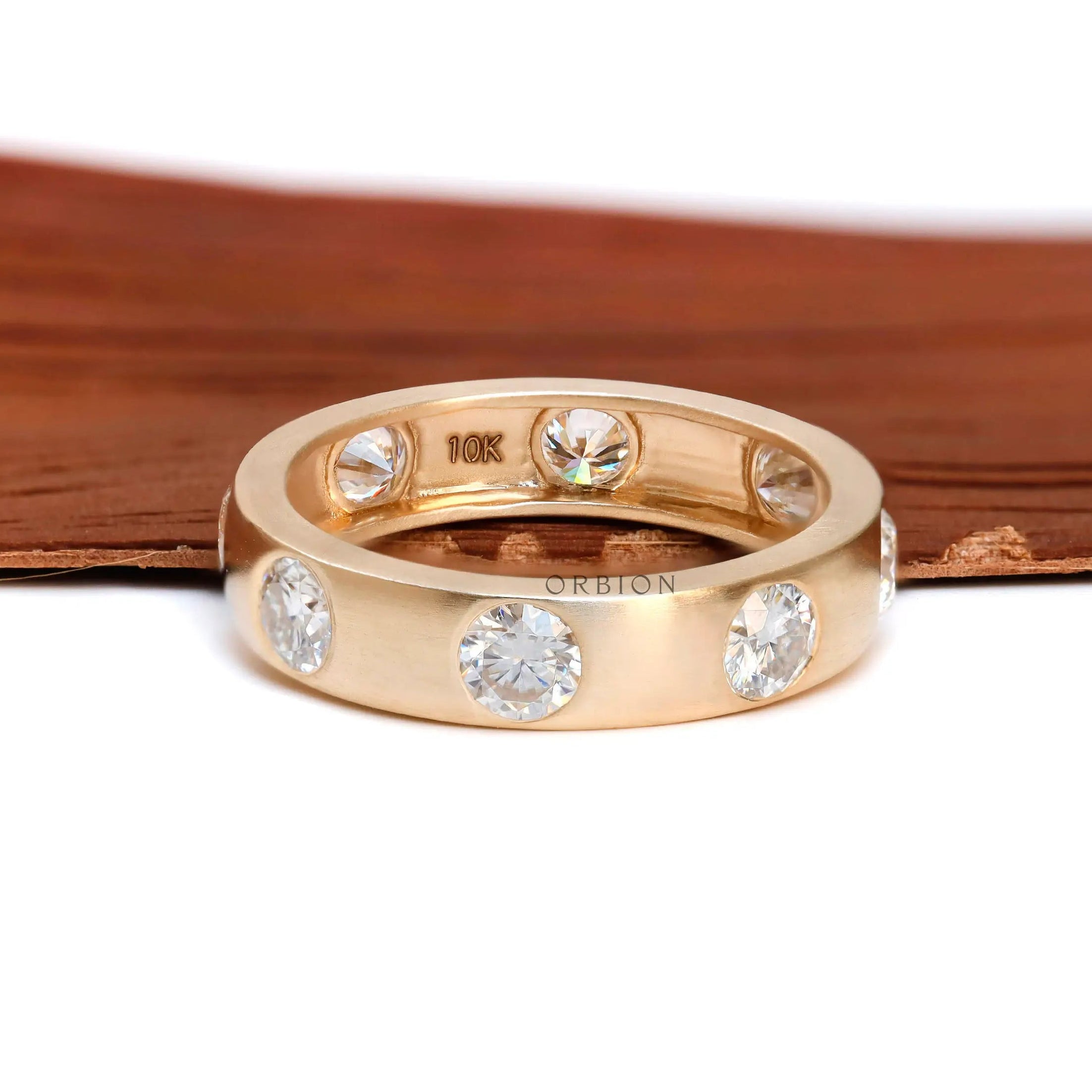 5 MM wide matt yellow gold eternity band with round brilliant diamonds  