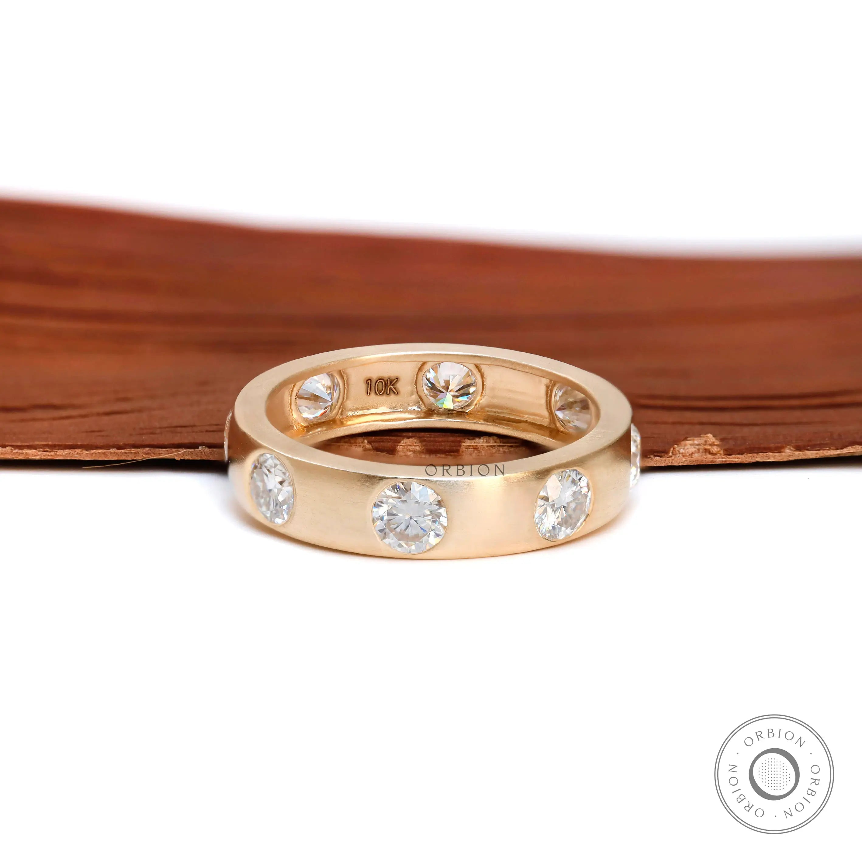 5 MM wide matt yellow gold eternity band with round brilliant diamonds  