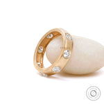 Modern flush set diamond wedding band side profile view  