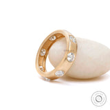 Modern flush set diamond wedding band side profile view  