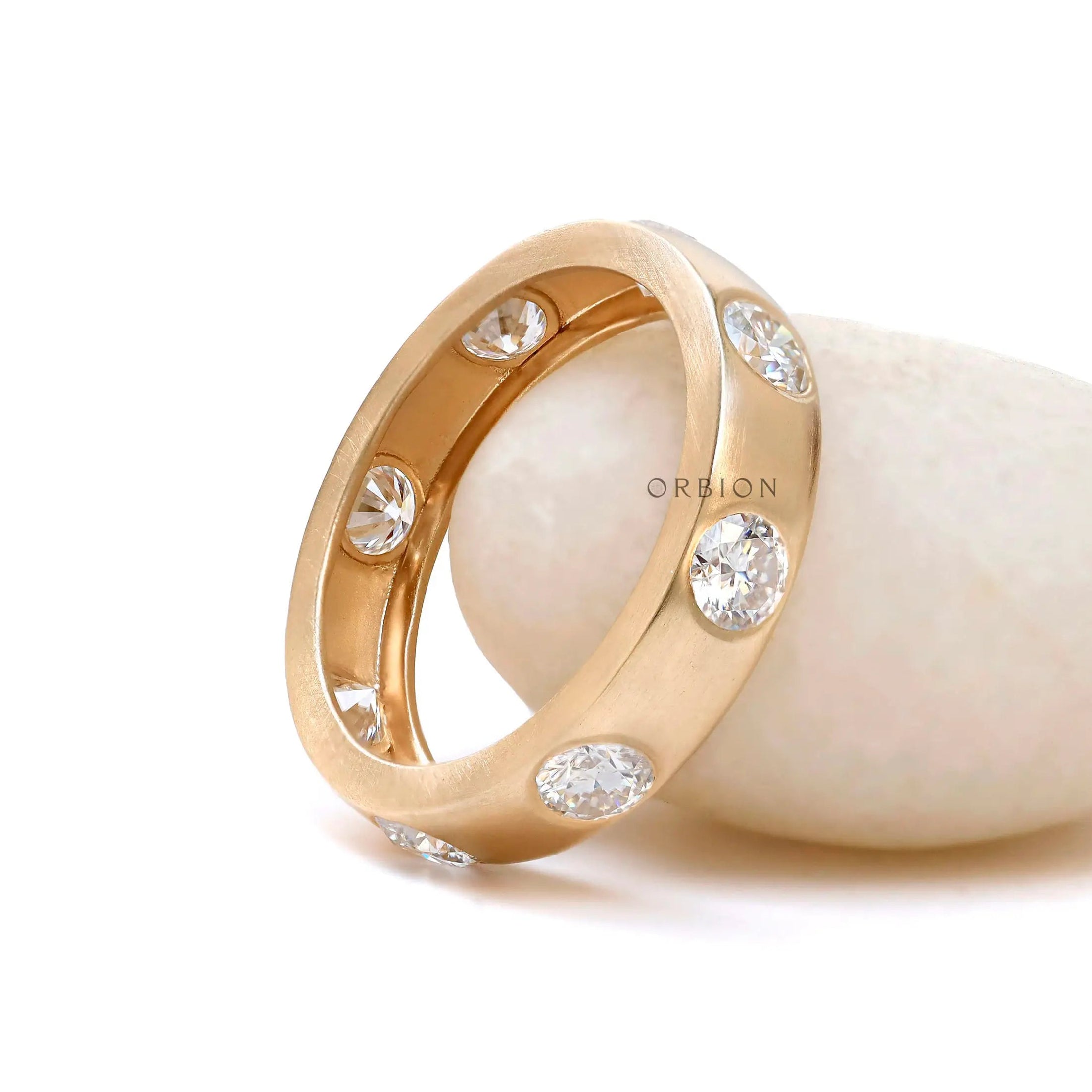 Modern flush set diamond wedding band side profile view  