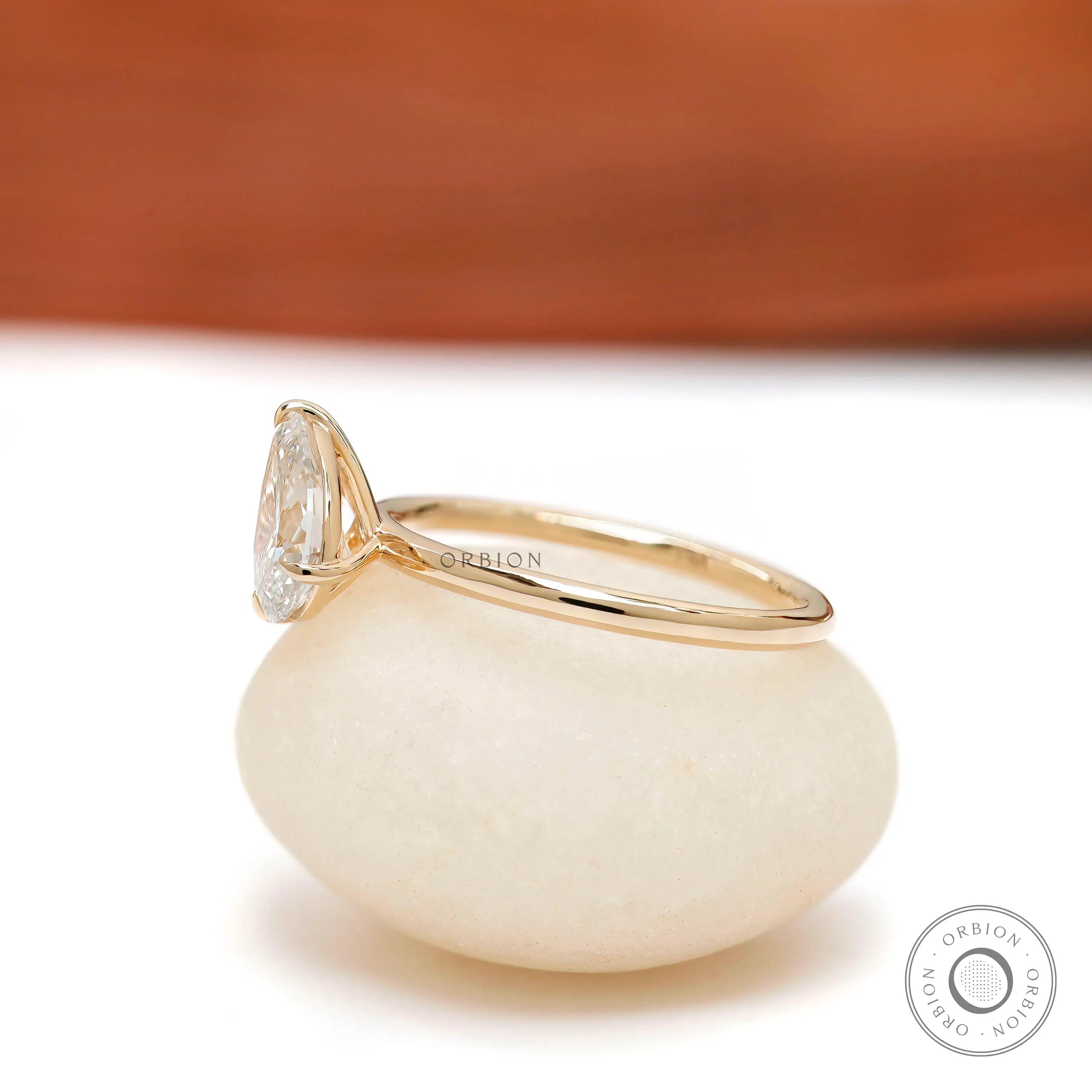 Modern pear cut two stone engagement ring glossy band