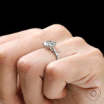 Cathedral mount round diamond ring close up