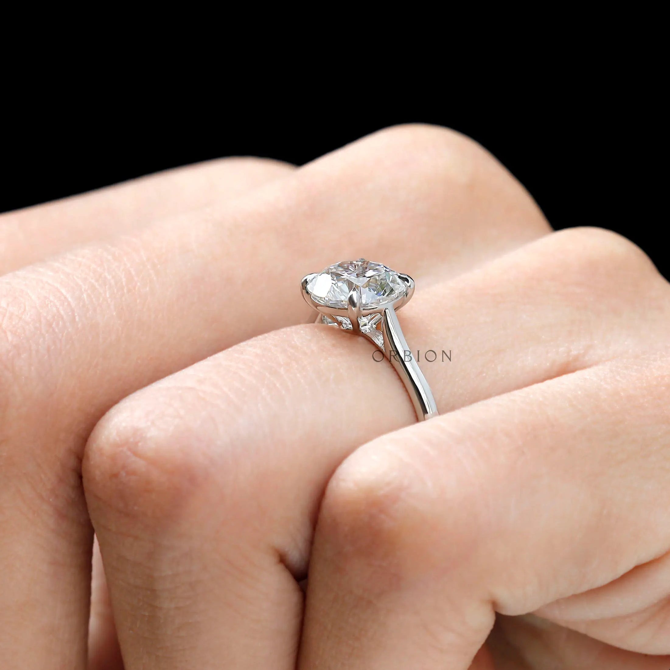 Cathedral mount round diamond ring close up
