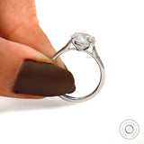 Cathedral setting round moissanite engagement ring side view