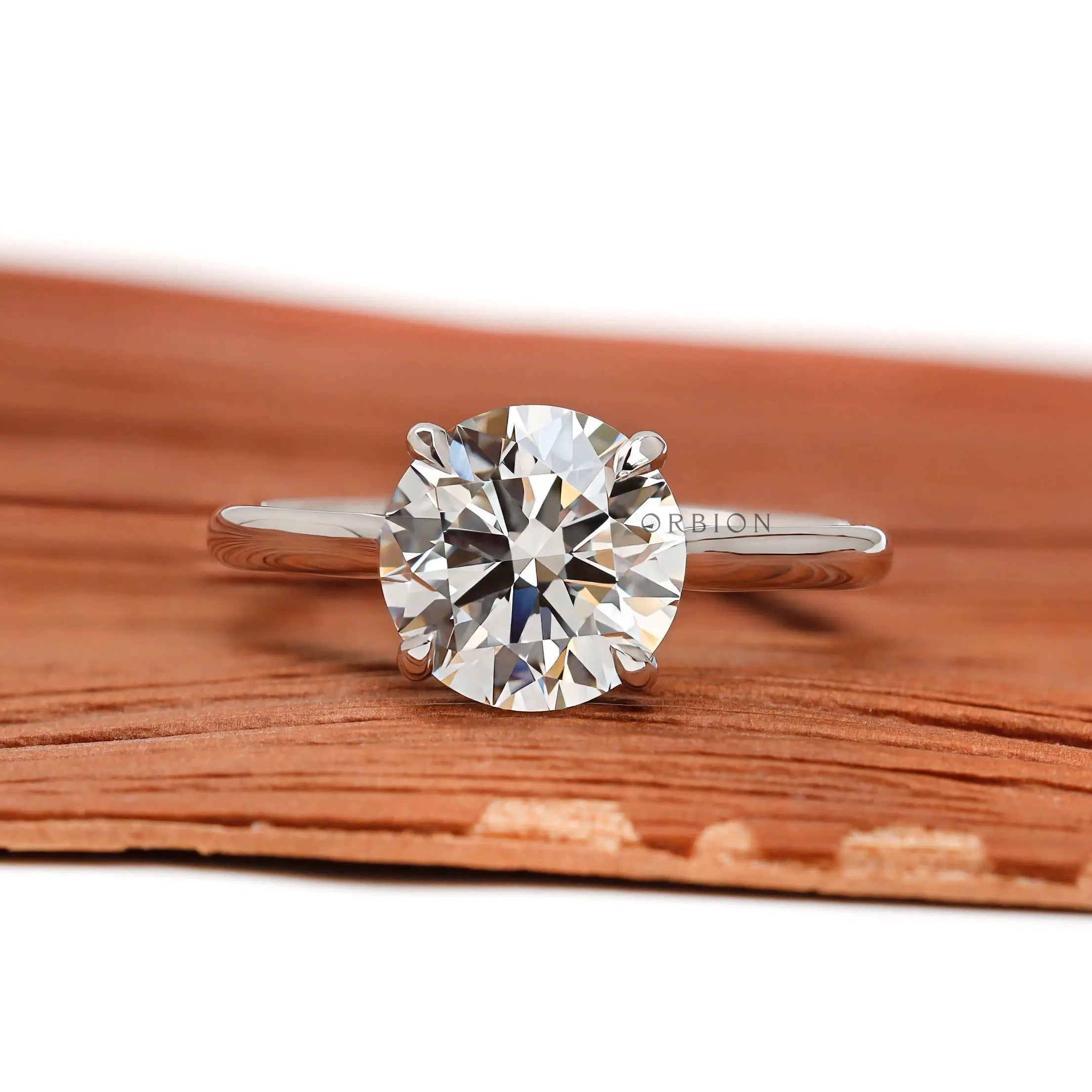 Brilliant cut round lab diamond solitaire ring white gold close up