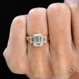 Bezel 3 stone emerald cut ring with thicker band 
