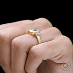 Emerald cut trilogy engagement ring with baguette accents