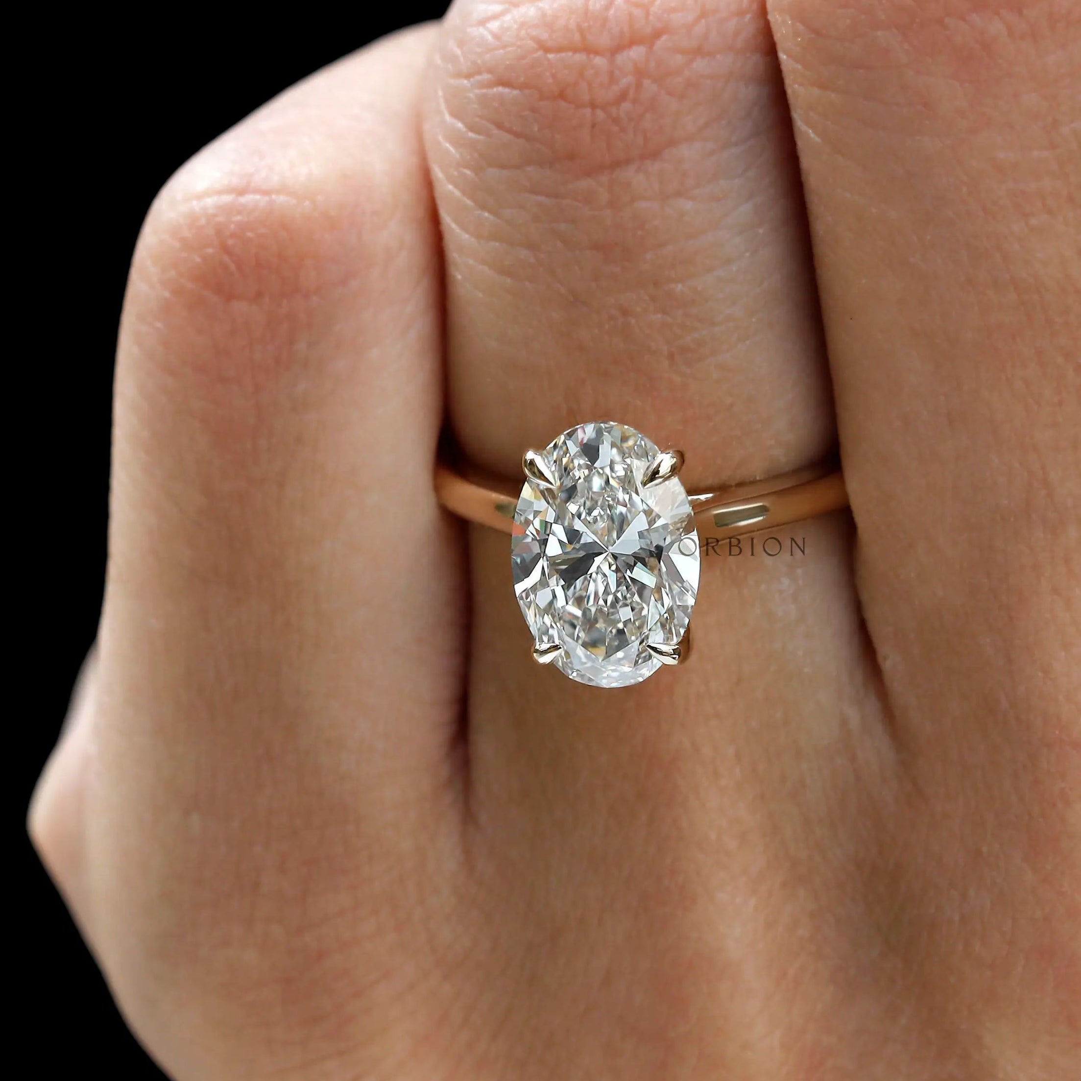 Close up of 3 ct oval cut moissanite engagement ring