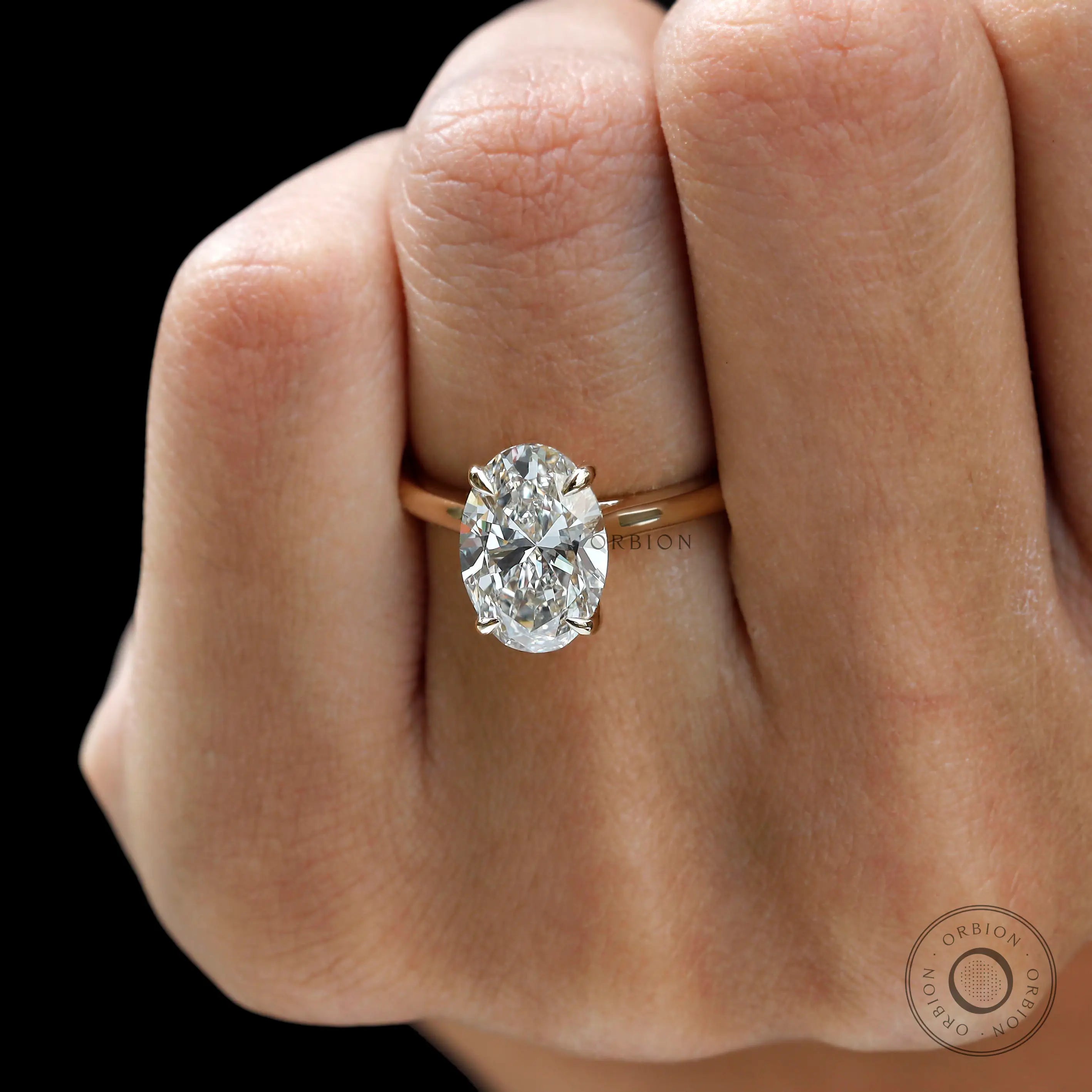 Close up of 3 ct oval cut moissanite engagement ring