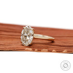 hidden halo oval engagement ring side profile view