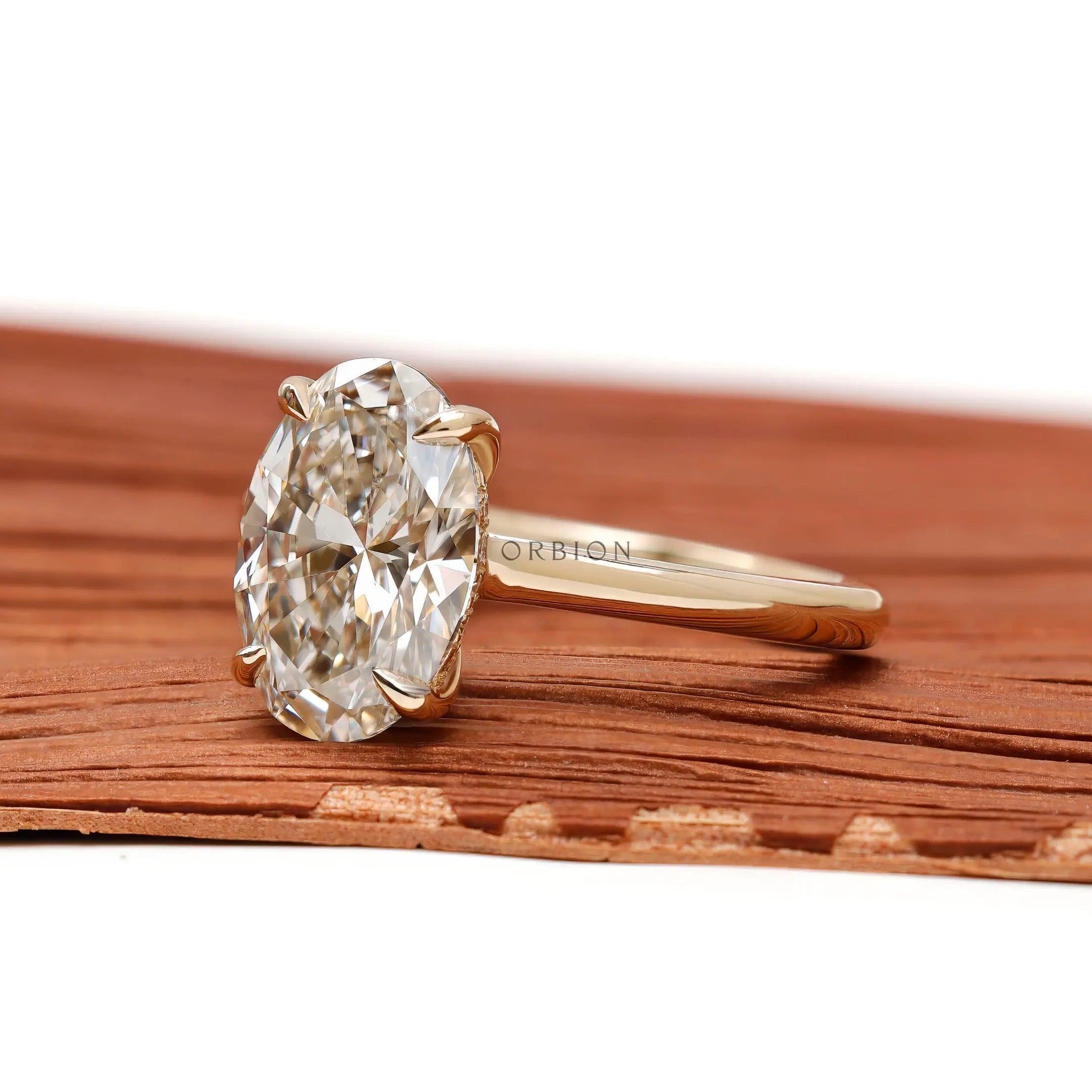 hidden halo oval engagement ring side profile view