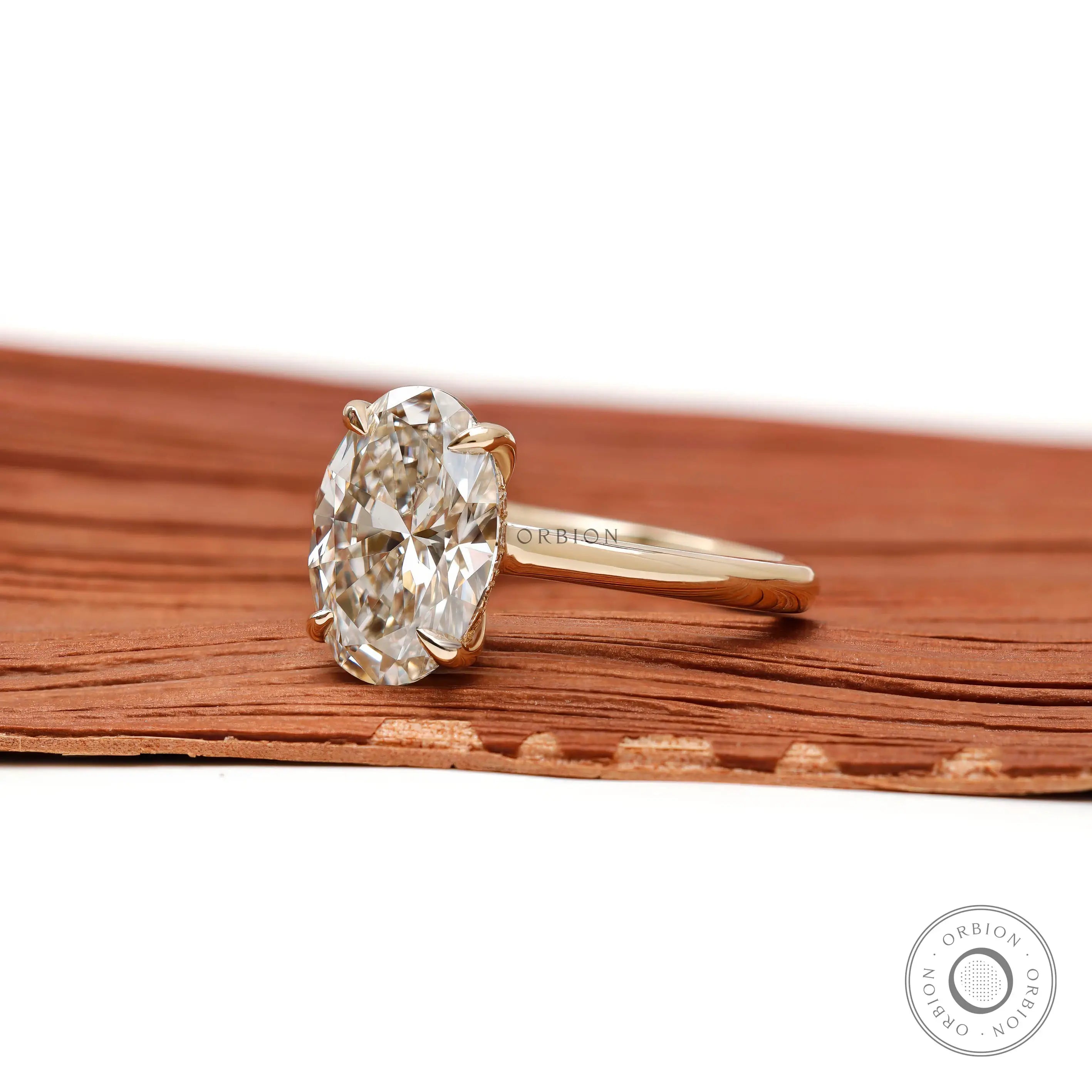 hidden halo oval engagement ring side profile view