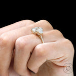 Cathedral setting emerald lab diamond ring detail view