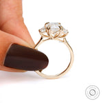 Modern emerald cut trilogy engagement ring