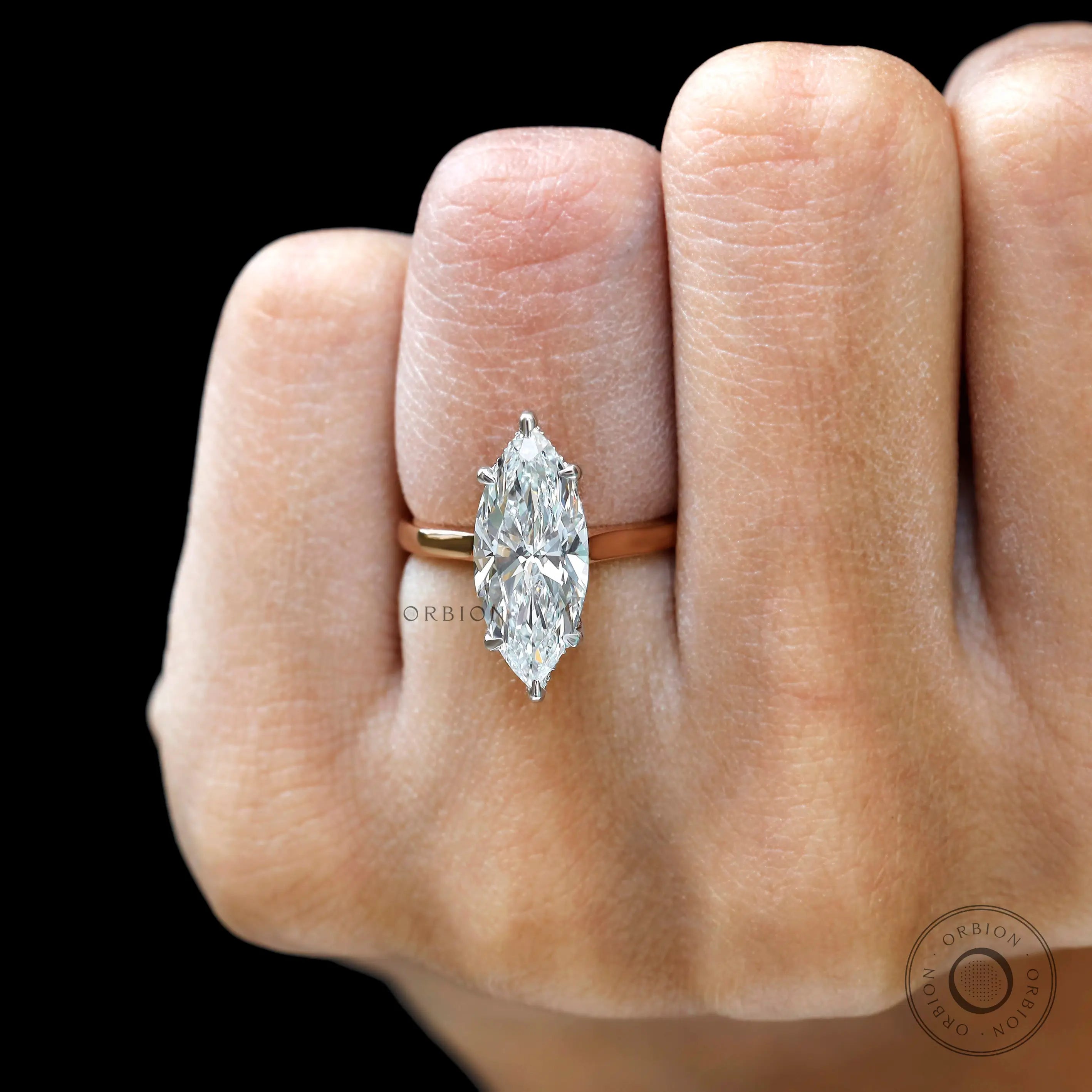 Big marquise lab grown diamond ring on finger close up