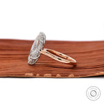 Two tone gold engagement ring with slim glossy band