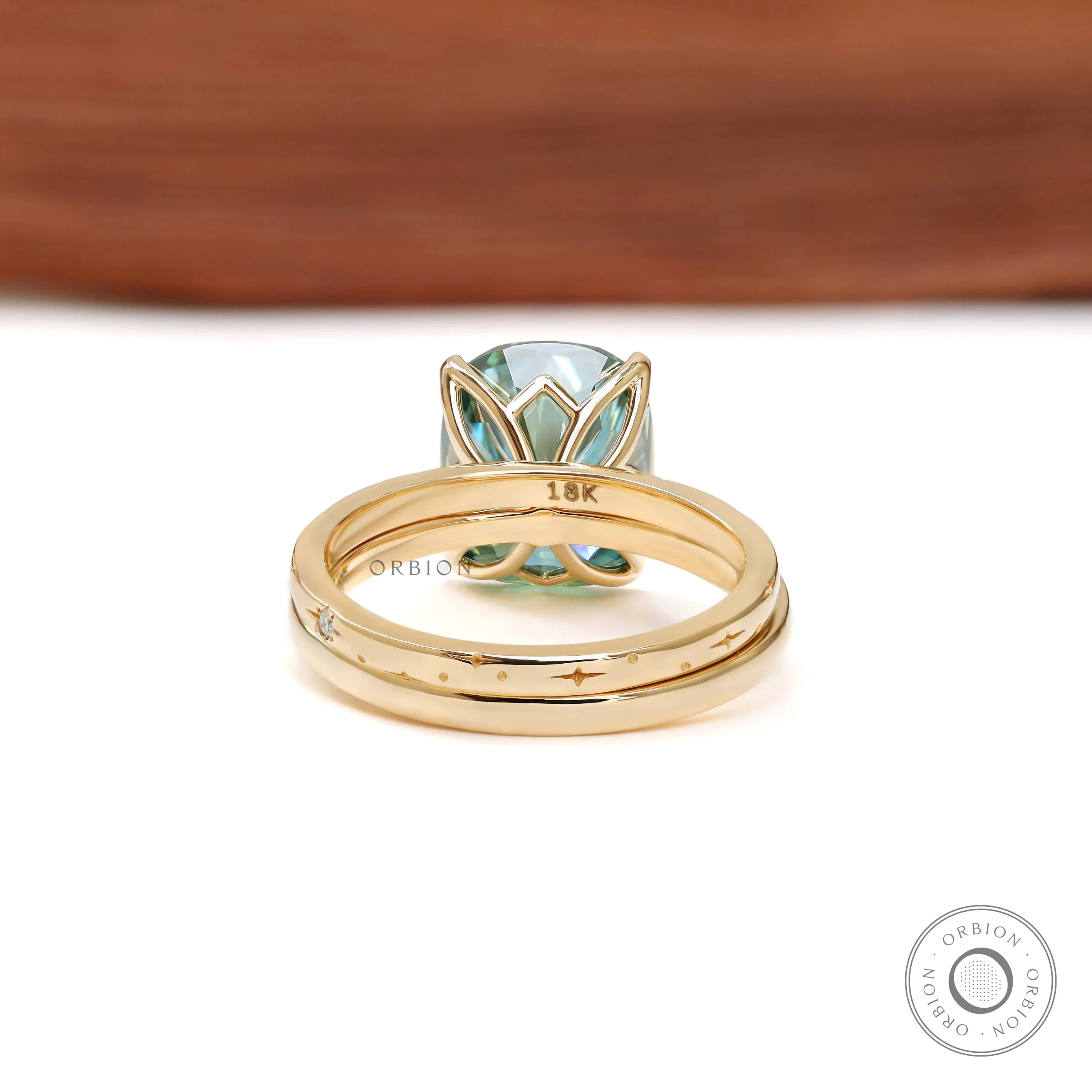 Unique starburst moissanite ring set in yellow gold with celestial design band
