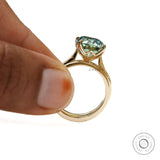 Elongated cushion teal moissanite ring with matching star and moon band