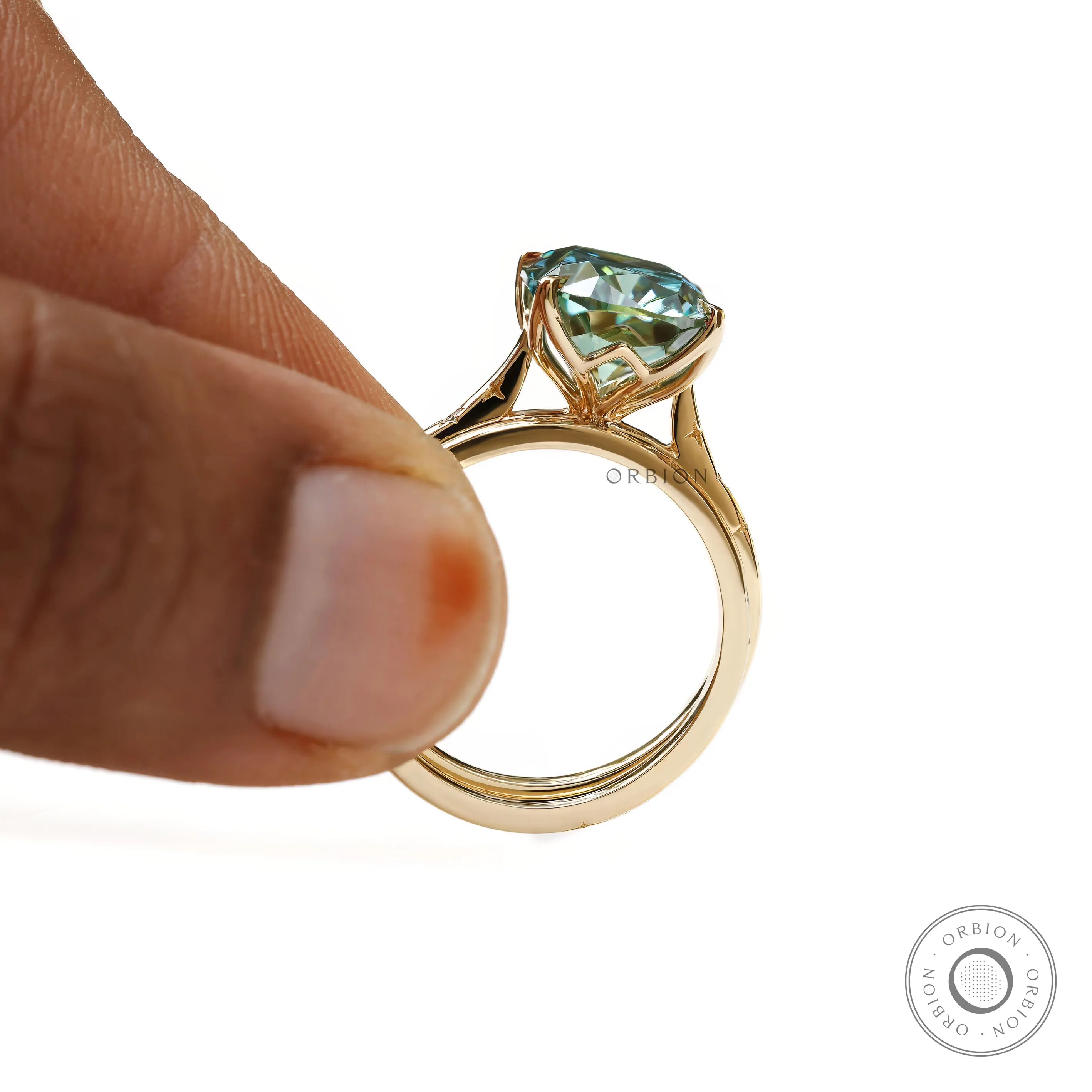 Elongated cushion teal moissanite ring with matching star and moon band