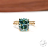 Elongated cushion blue green moissanite starburst ring with celestial band in 18k yellow gold