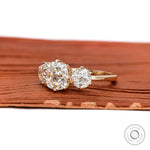 Lab diamond cushion engagement ring with round side stones