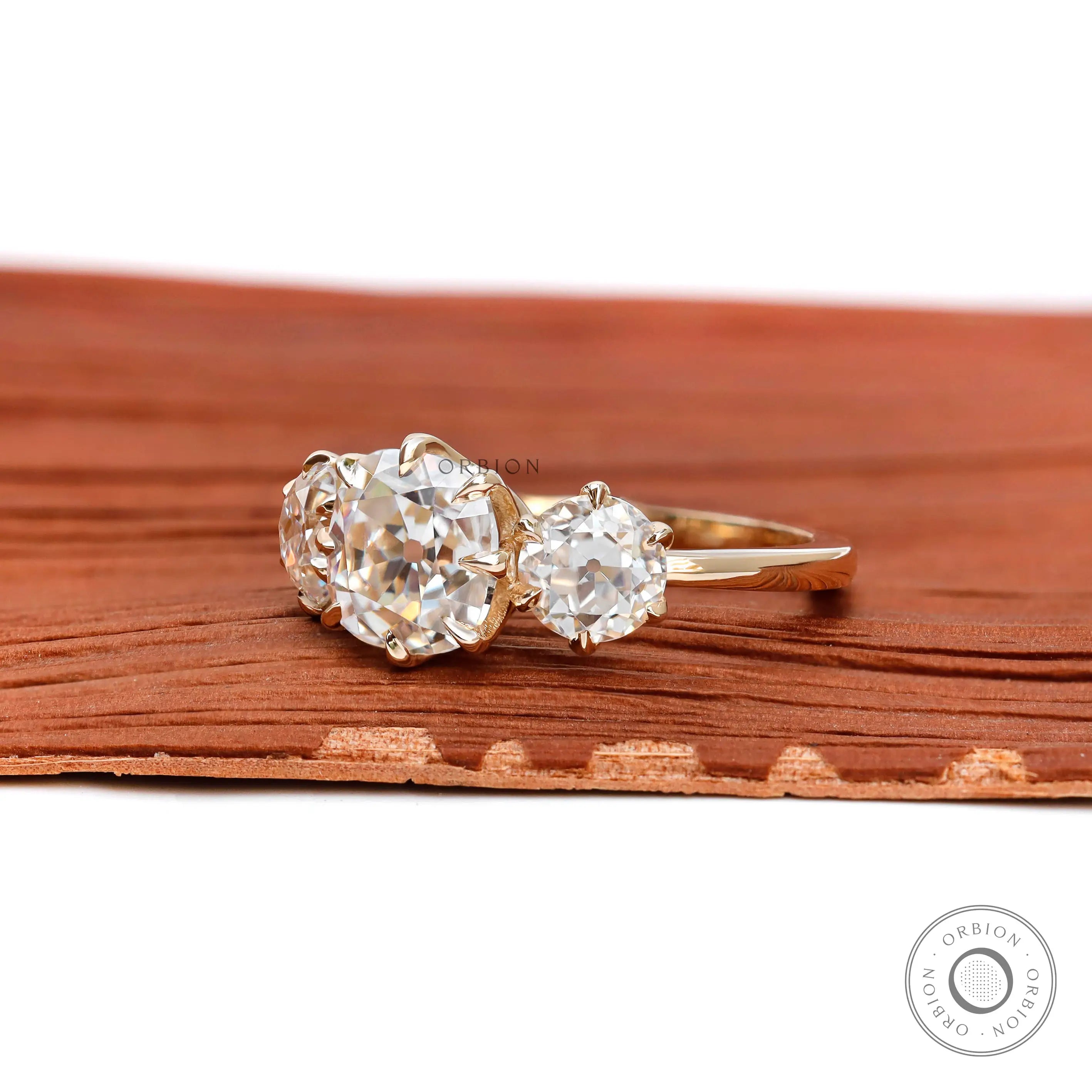 Lab diamond cushion engagement ring with round side stones