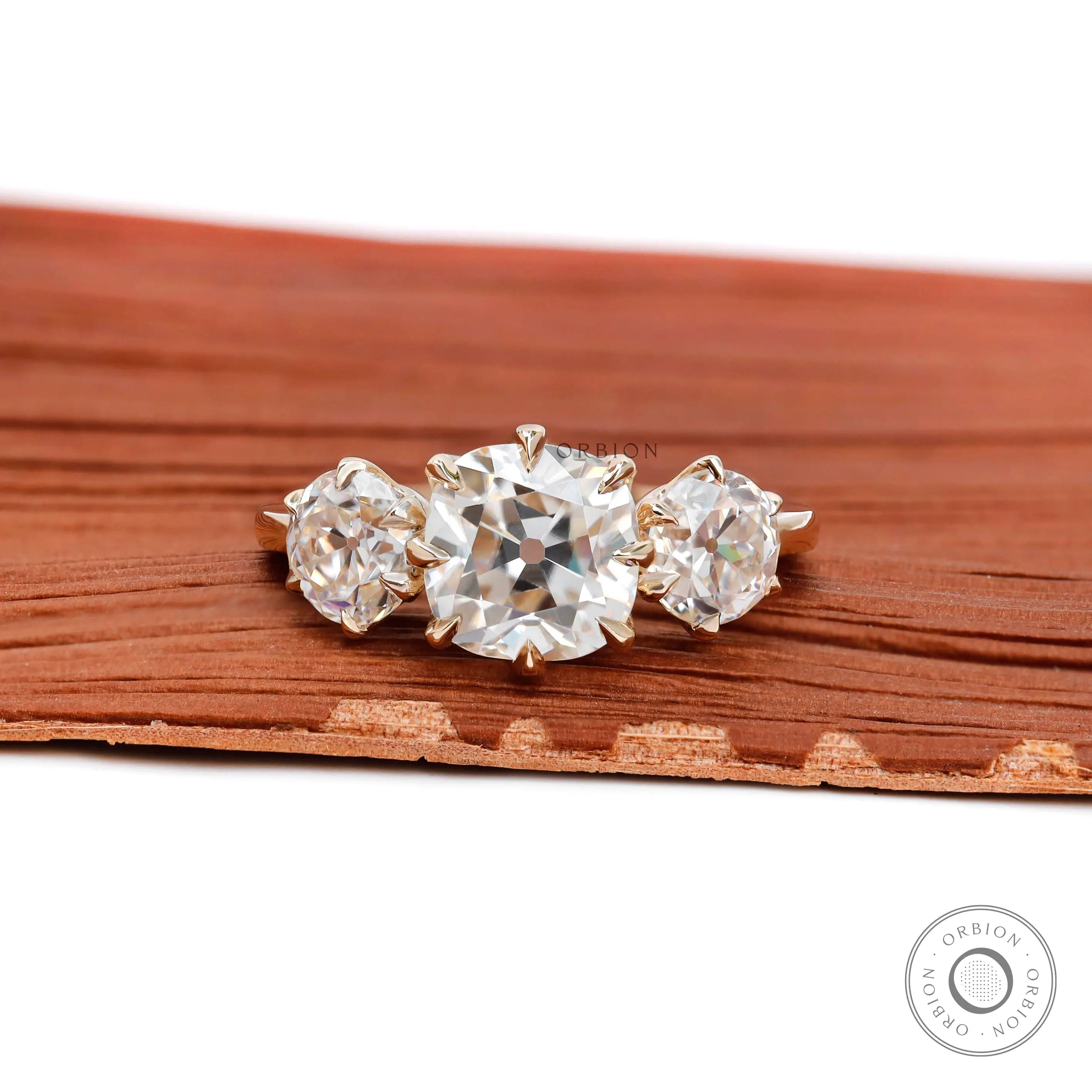 Vintage cushion Old Mine cut three stone engagement ring in 14K yellow gold