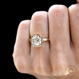 Sculpted bezel cushion engagement ring