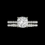 Cushion cut hidden halo cathedral engagement ring set in 14K white gold