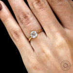 Elegant 18k gold cushion solitaire ring close up