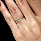 Elegant 18k gold cushion solitaire ring close up