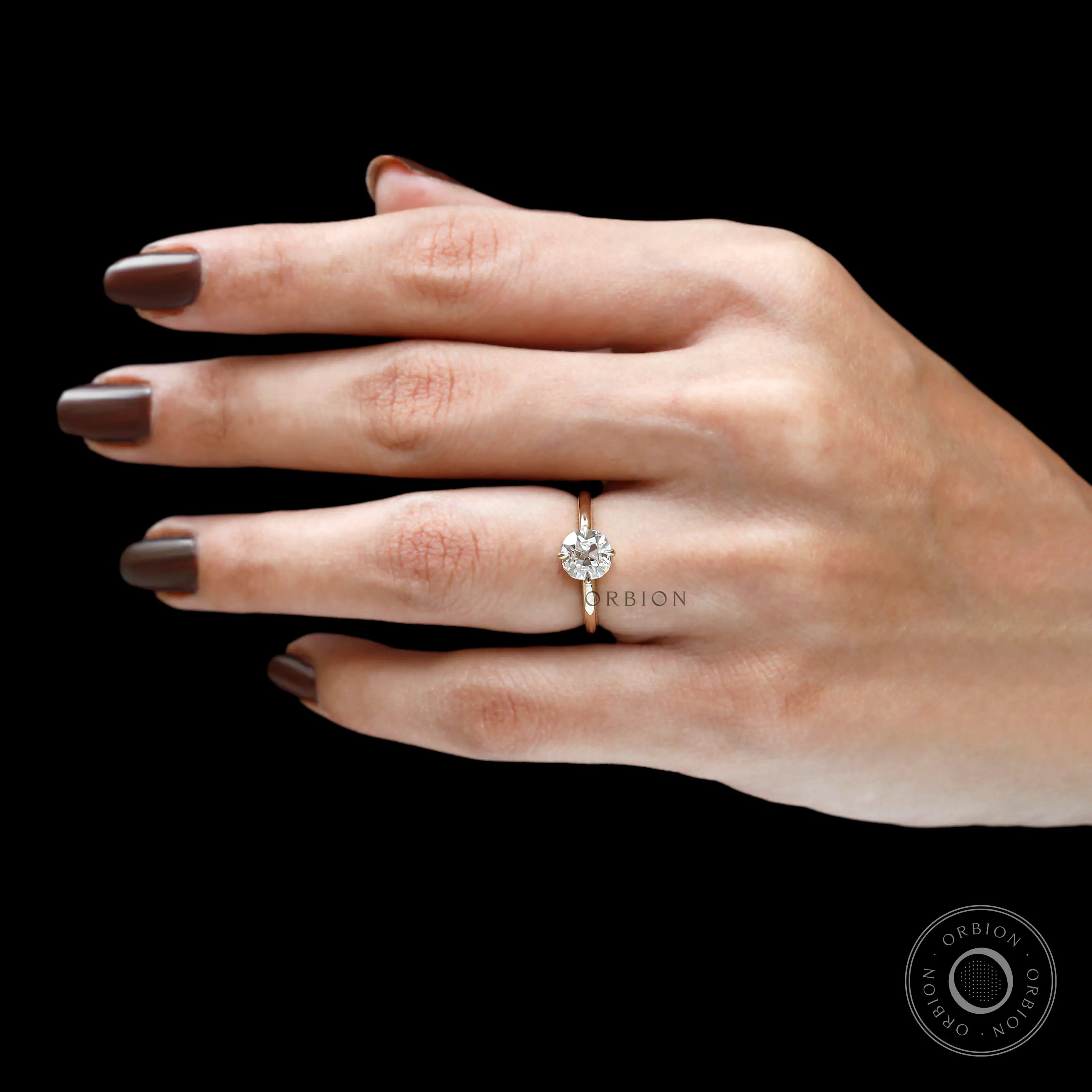 Timeless old mine cut engagement ring on finger
