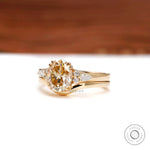 Oval champagne moissanite engagement ring with curved wedding band  