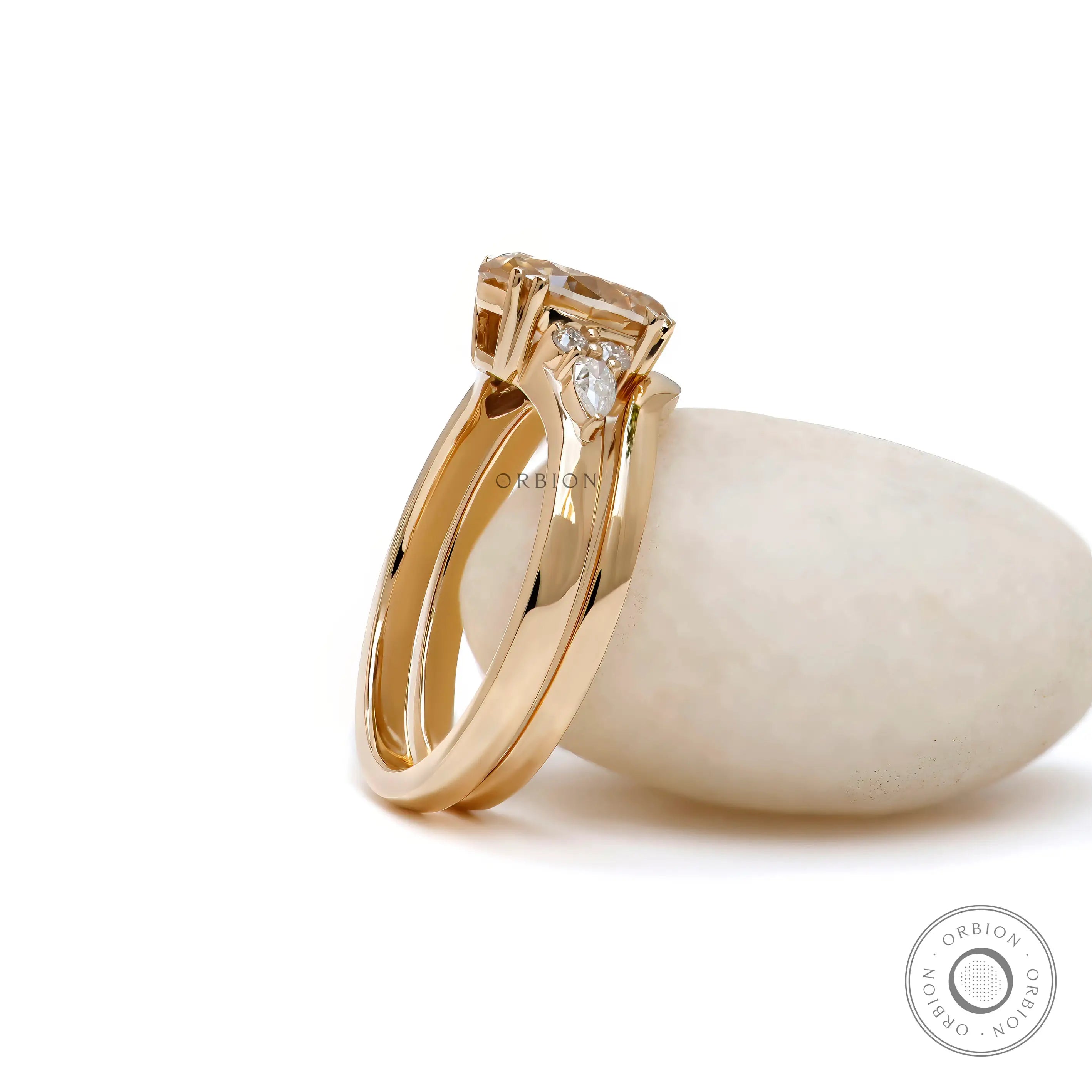 Matching curved band fitted to oval moissanite engagement ring  