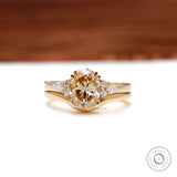 Oval light champagne moissanite bridal ring set in 18k yellow gold front view 