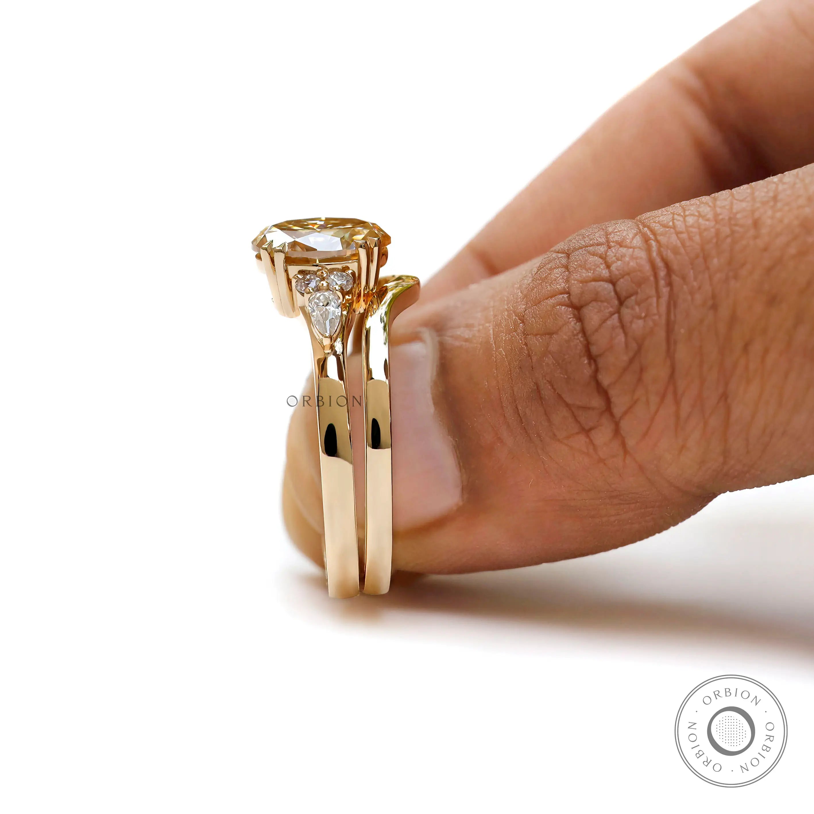 Glossy 18k yellow gold bridal set with oval brilliant cut moissanite  