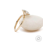 14k yellow gold oval cut engagement ring with glossy finish 