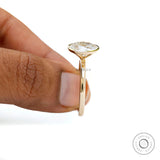 Elegant minimalist yellow gold engagement ring with oval center stone  