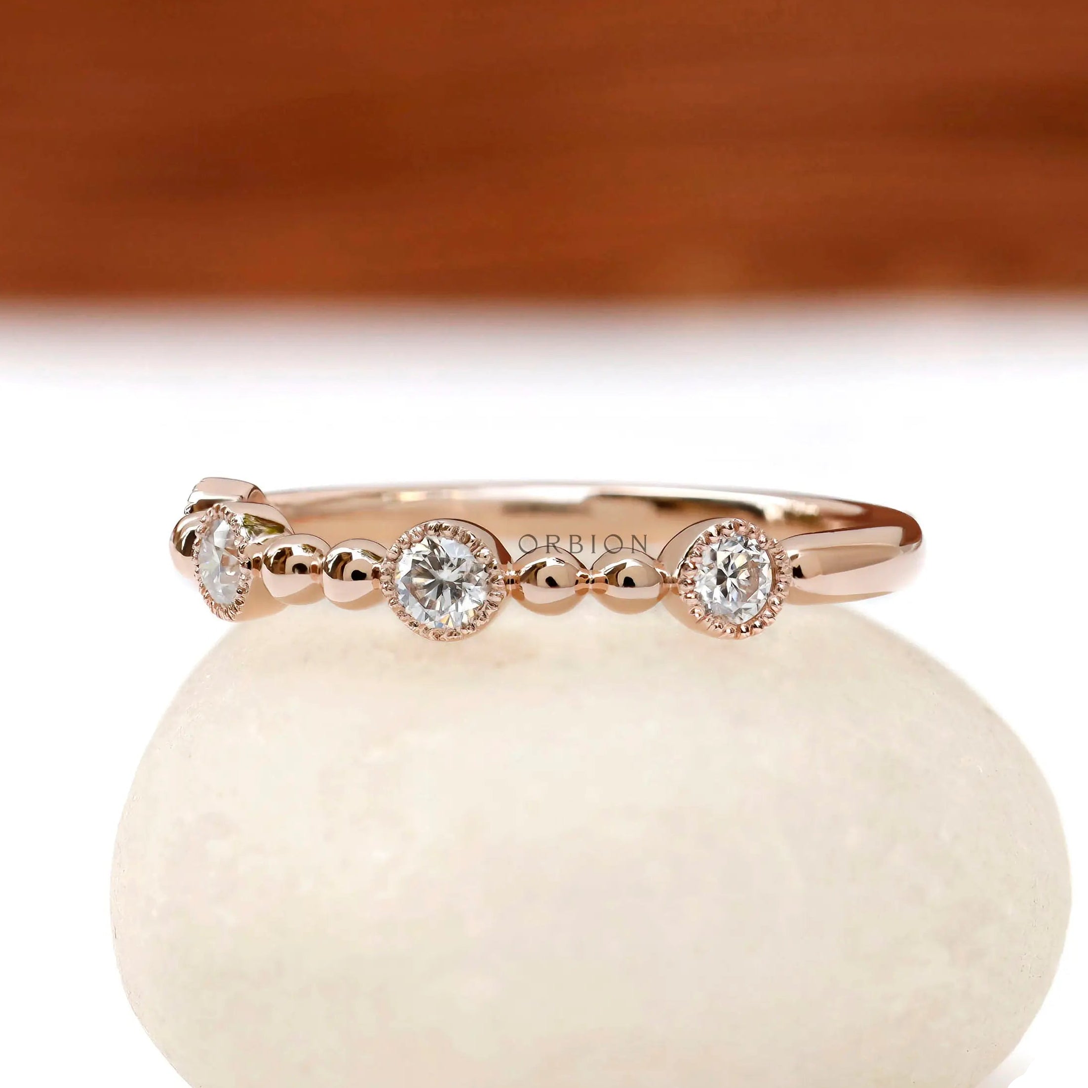 Art Deco stacking ring with milgrain bezel set round stones in rose gold side profile