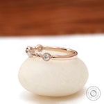  14k rose gold half eternity band with  round brilliant lab diamonds