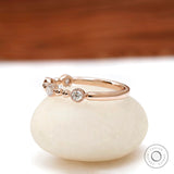  14k rose gold half eternity band with  round brilliant lab diamonds