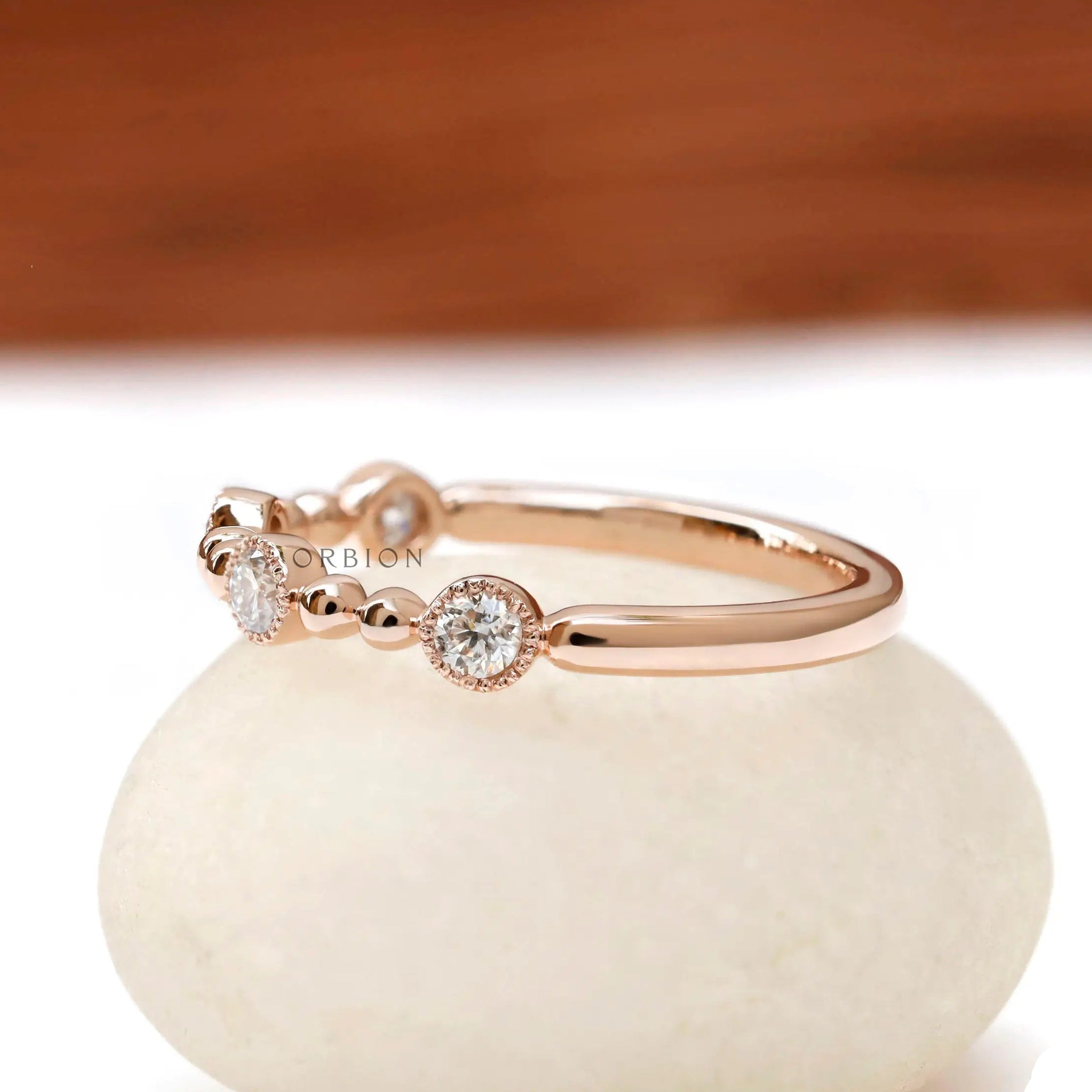  14k rose gold half eternity band with  round brilliant lab diamonds