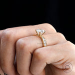 Channel set round accent stones on yellow gold band