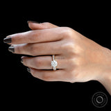 18k yellow gold round moissanite engagement ring on hand