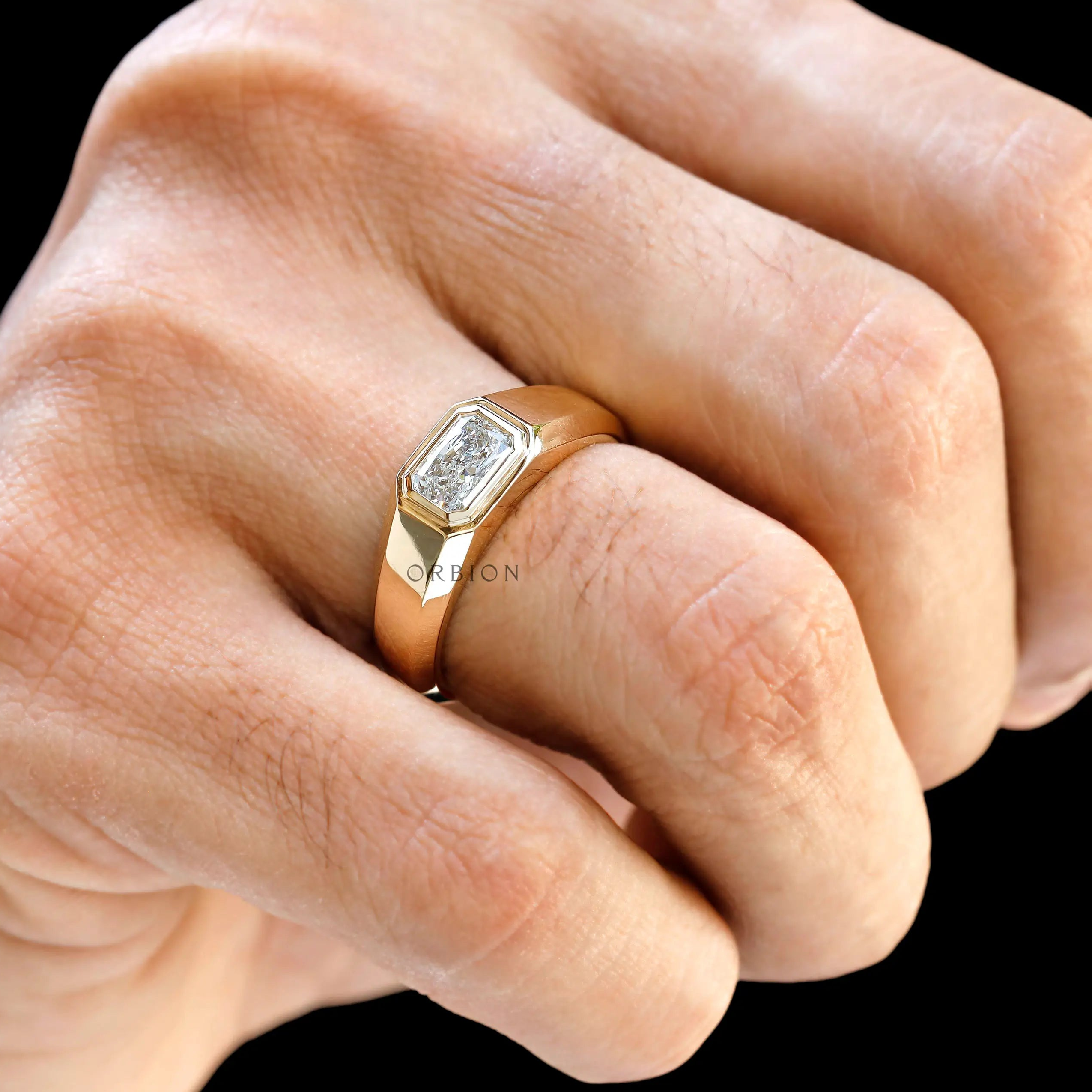 Hand worn mens east west radiant cut gold signet ring