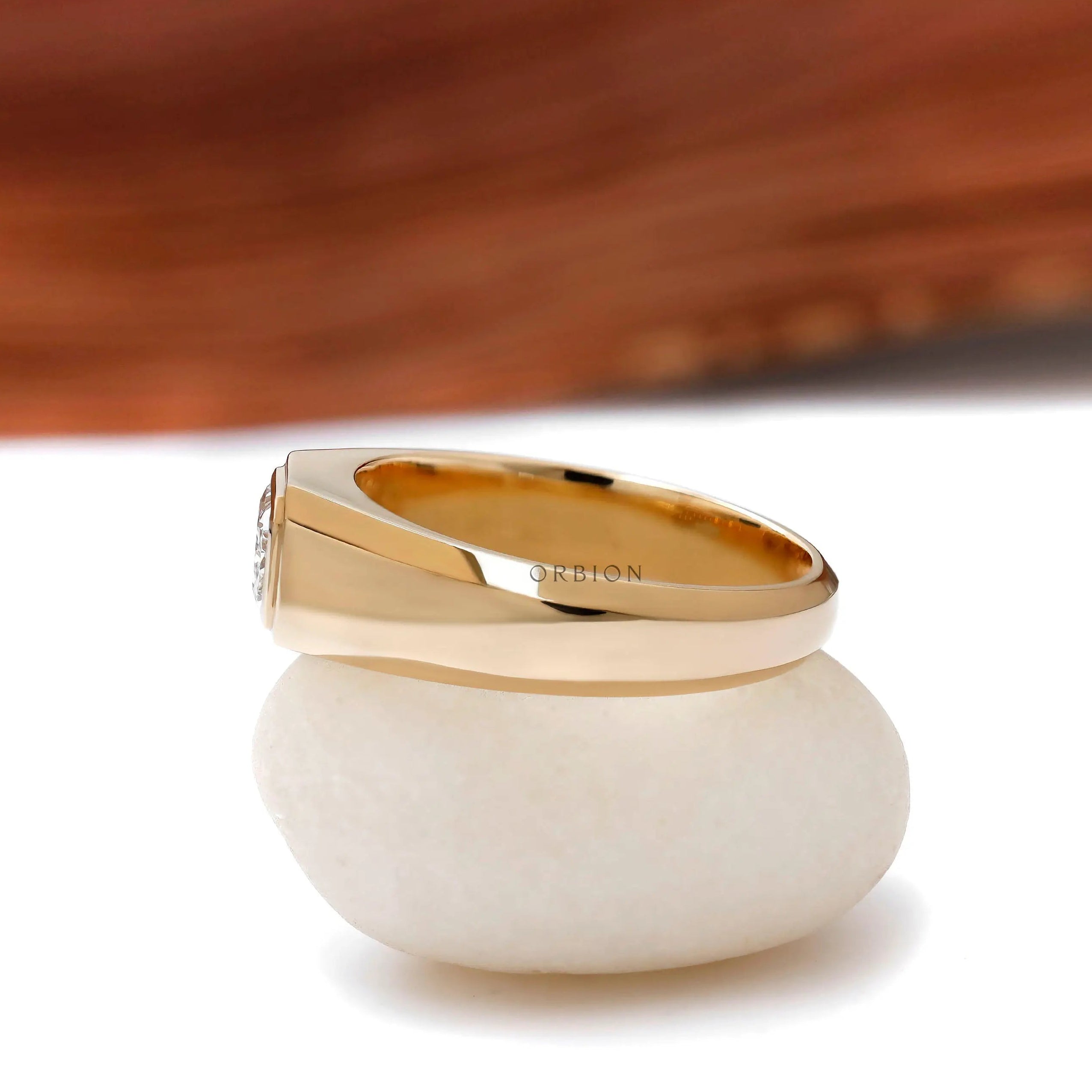 Tapered band mens signet ring with radiant center stone