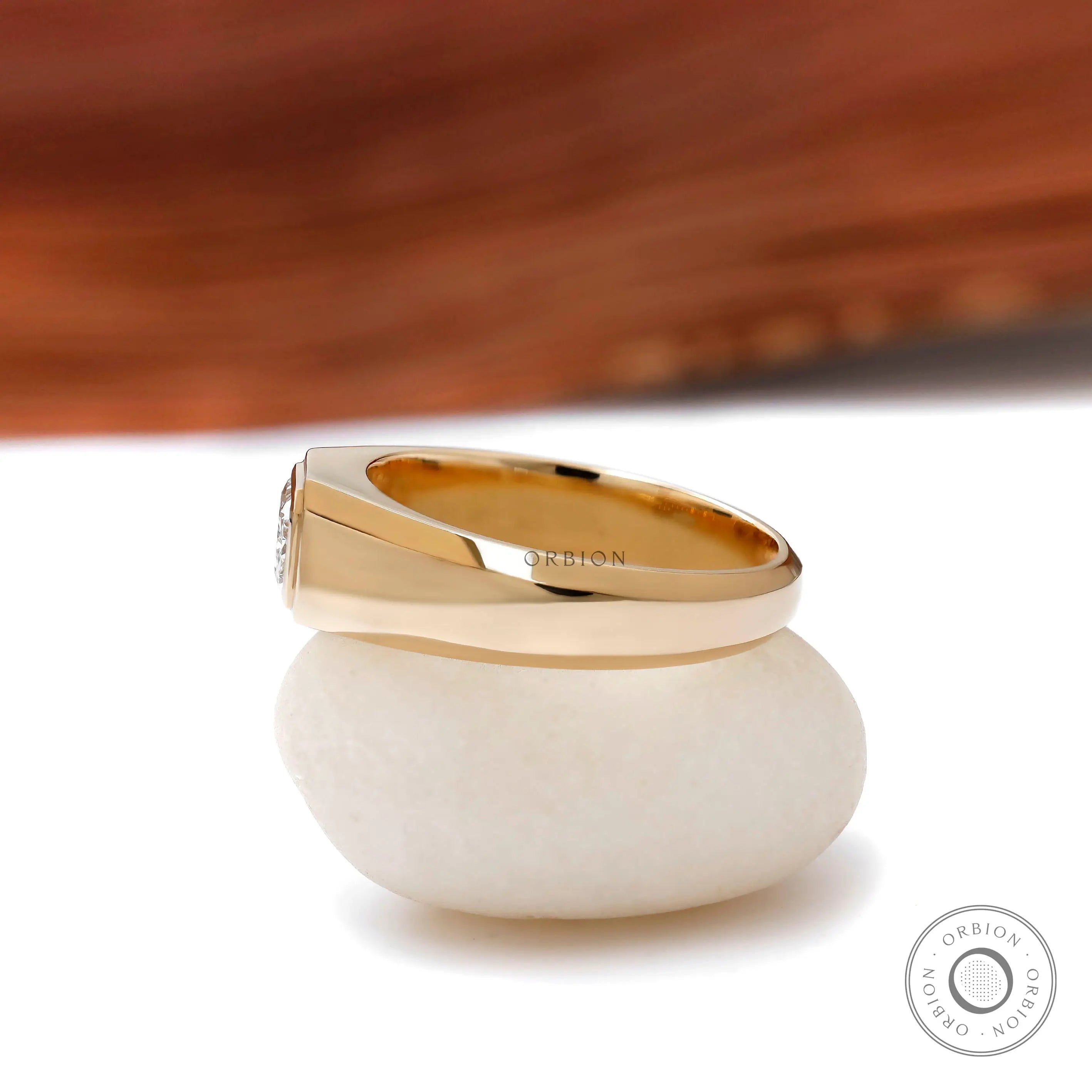 Tapered band mens signet ring with radiant center stone
